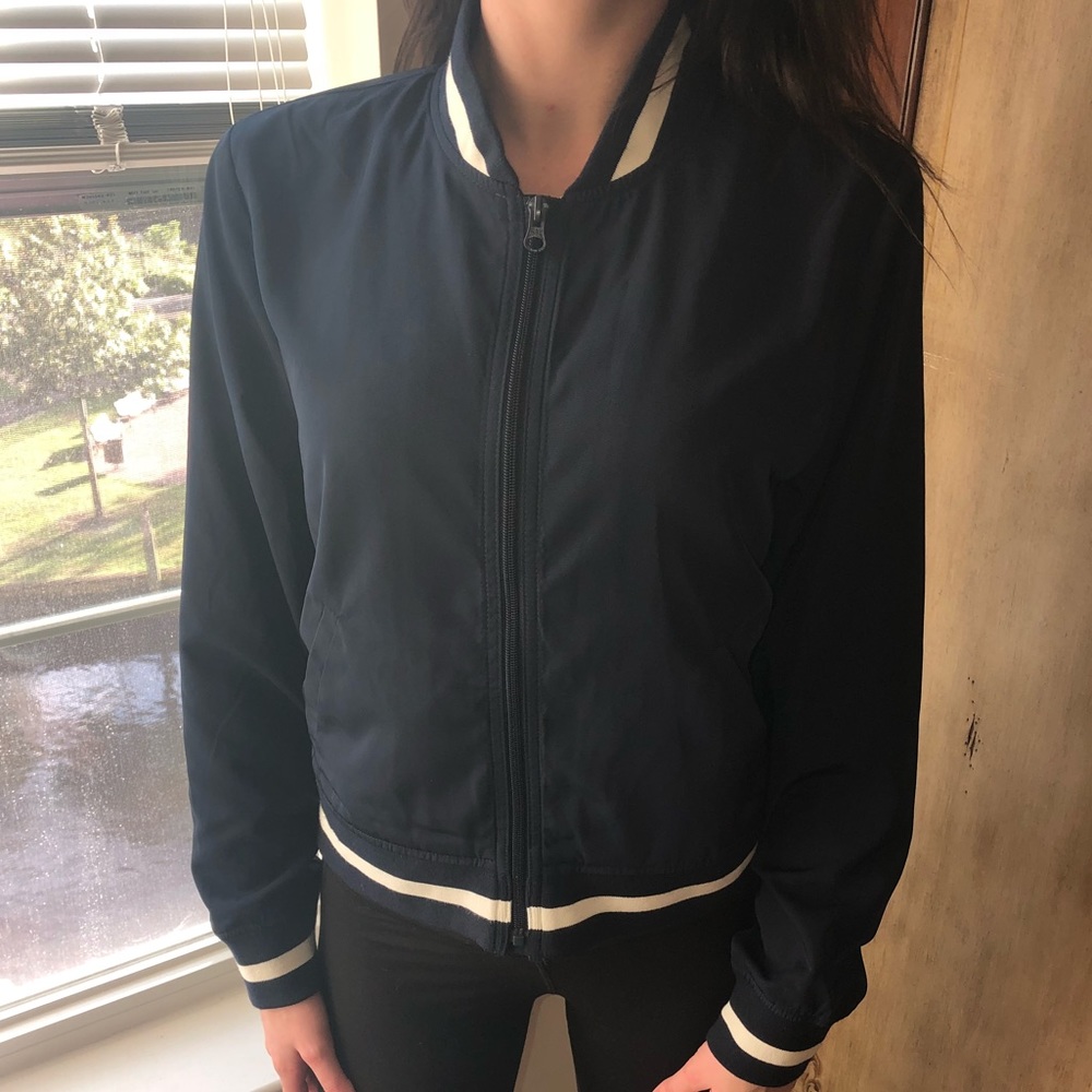 Navy and white varsity jacket.